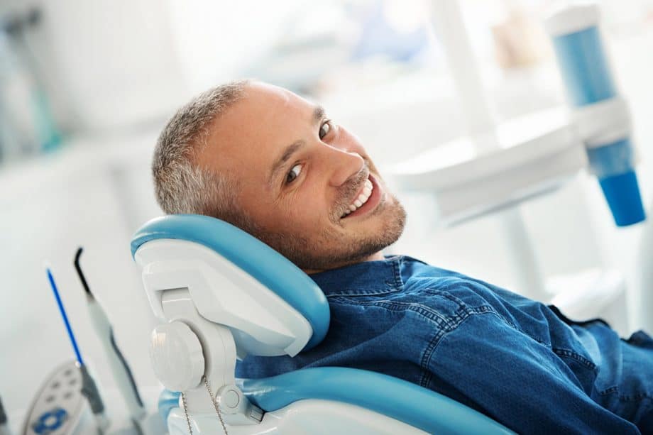 man laying back in dental chair