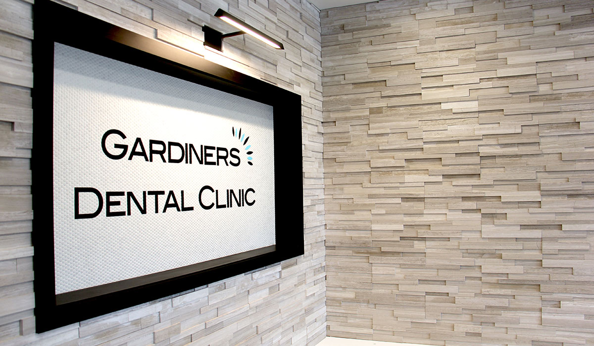 sign of Gardiners Dental Clinic inside hallway
