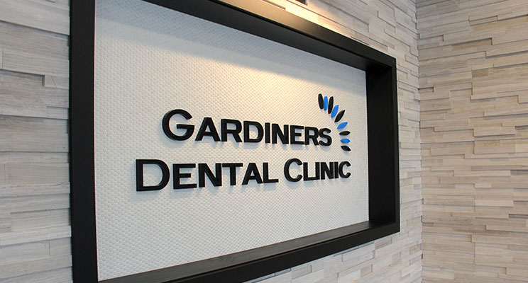 sign of Gardiners Dental Clinic inside hallway