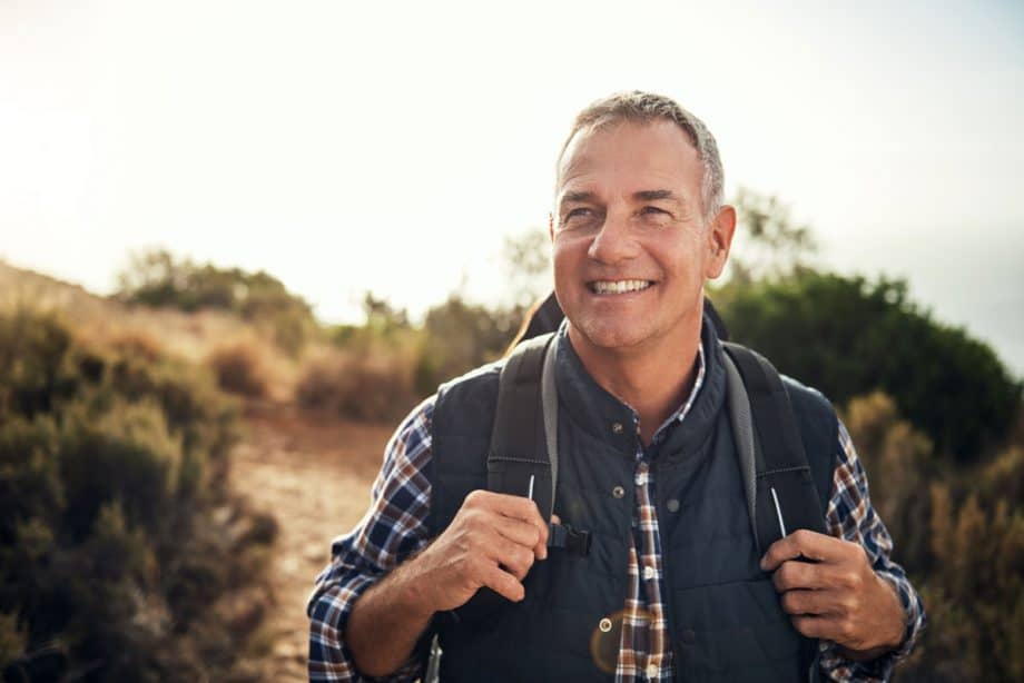 man hiking with backpack on