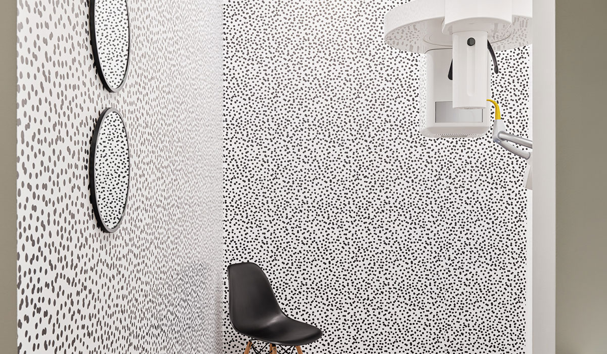 dental room with spotted wallpaper